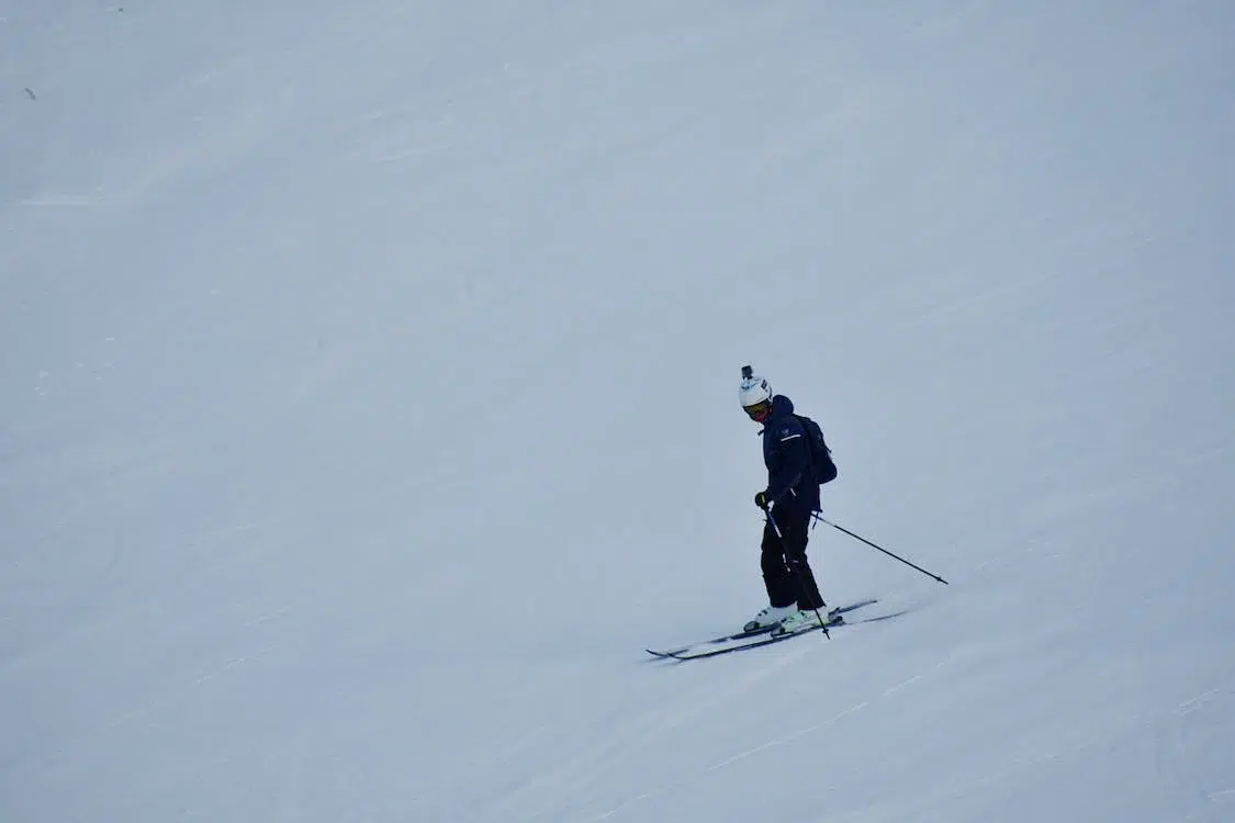 Skier Blue Jacket White Helmet