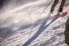 skier sliding down a steep hill