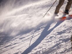 skier sliding down a steep hill