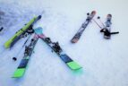skis laying on the ground in the snow