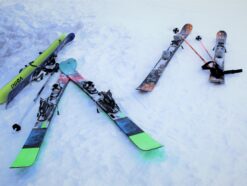 skis laying on the ground in the snow